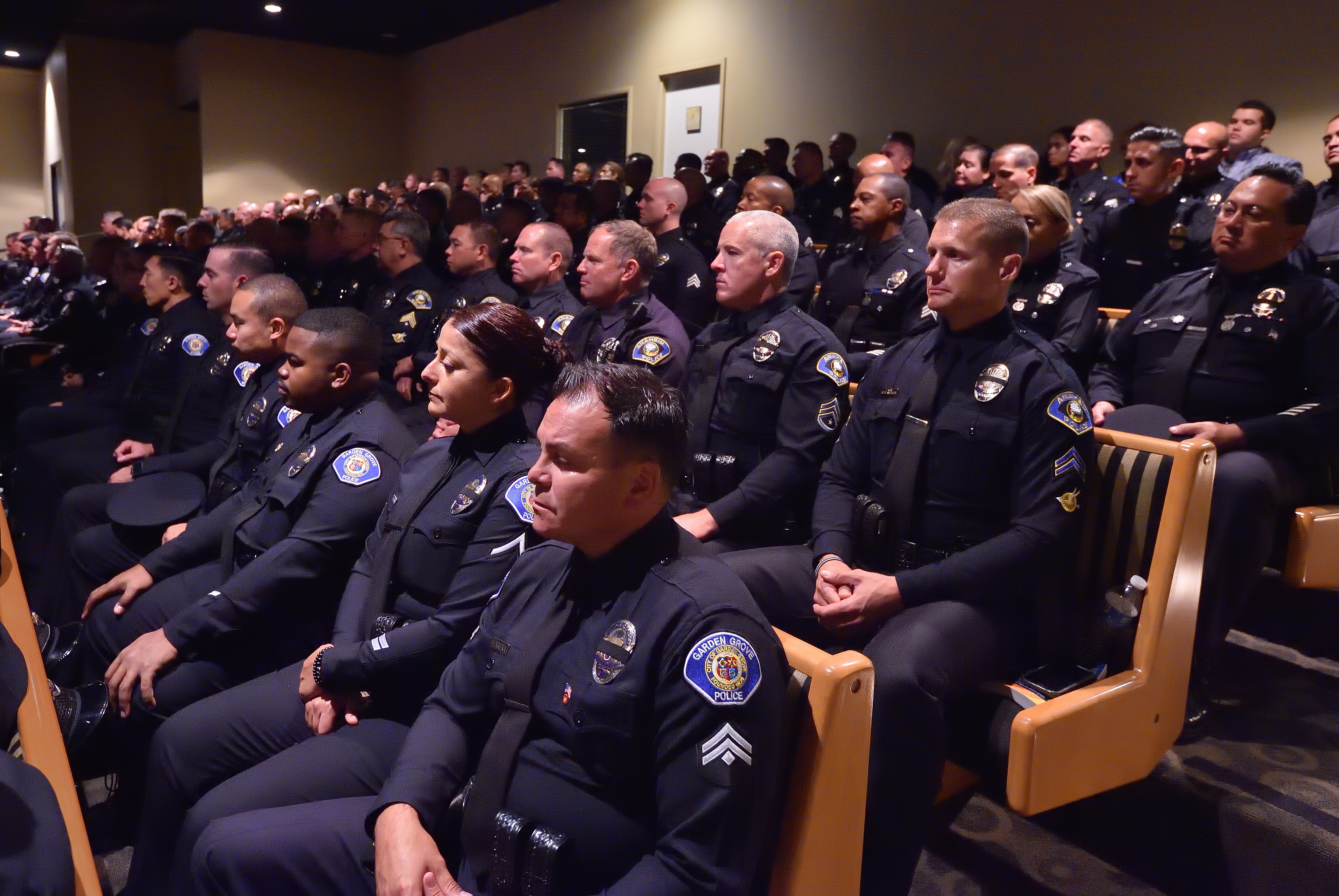 Law enforcement officers, including those from Garden Grove PD and Anaheim PD, attend the standing room only memorial service, from the upstairs balcony, for CHP Officer Andre Moye Jr.Photo by Steven Georges/Behind the Badge