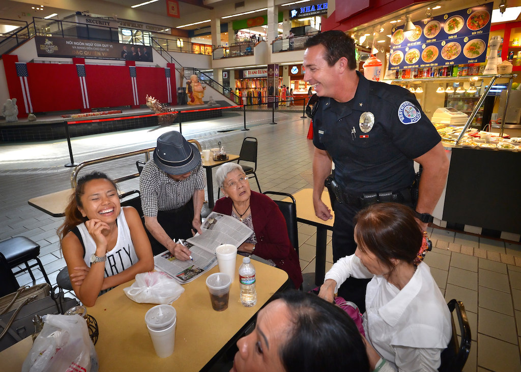 Commander Bill Collins of the Westminster Police Department walks through Phước Lộc Thọ (Phuc Loc Tho) known in English as Asian Garden Mall, the first Vietnamese-American business center in Little Saigon, as he connects with the people who work and visit the community.