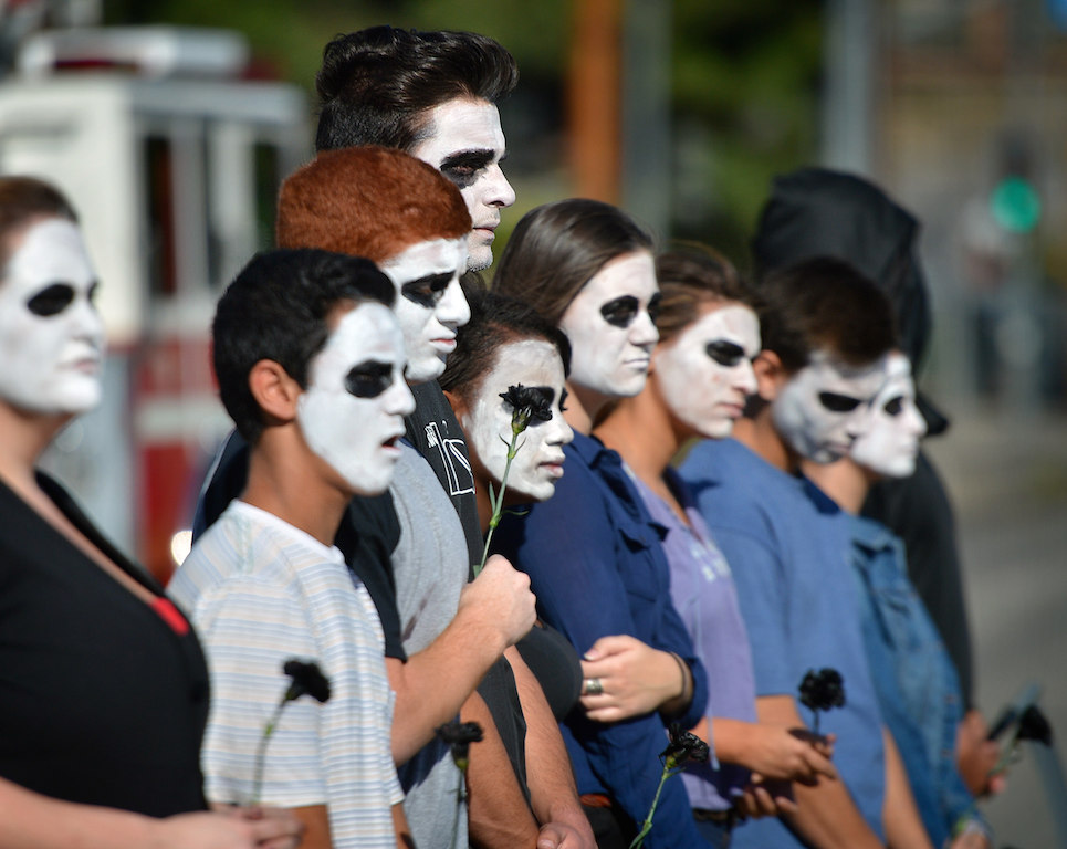 Students from Esperanza High School observe and participate in a program where a drunk driving related fatal car collision is staged in front of the school by Anaheim police and fire departments.