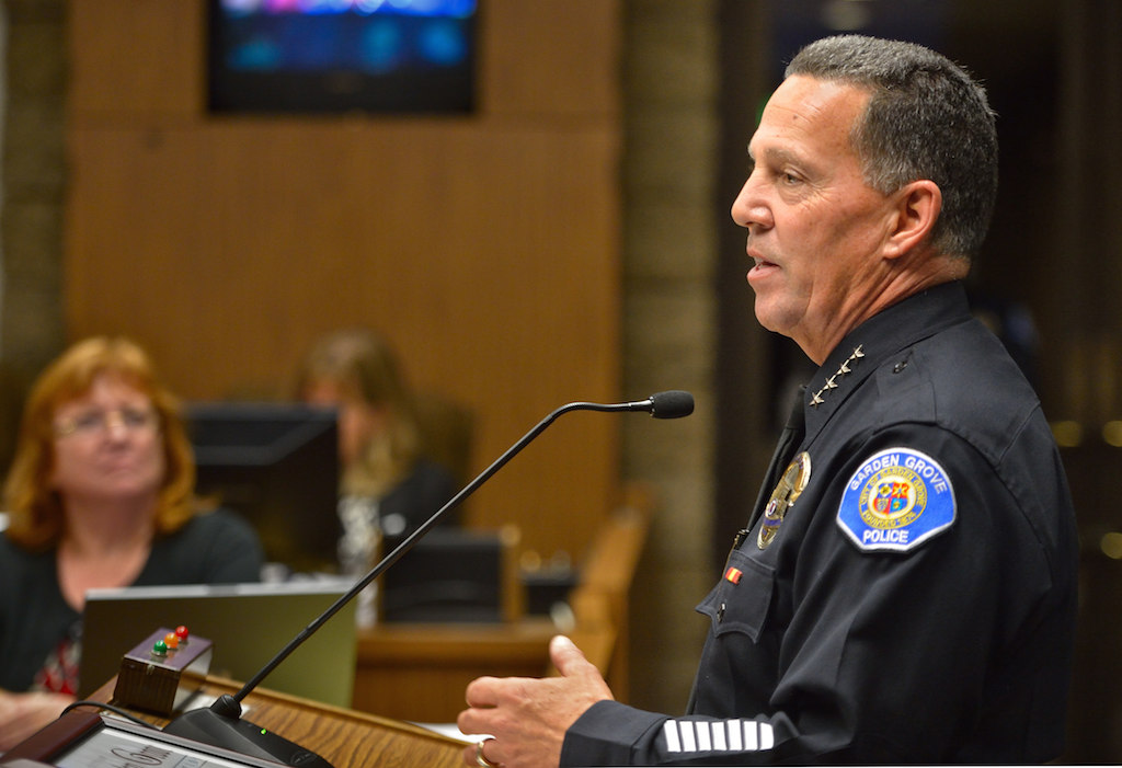 Retiring Garden Grove Chief of Police Kevin Raney is recognized during a city council meeting.
