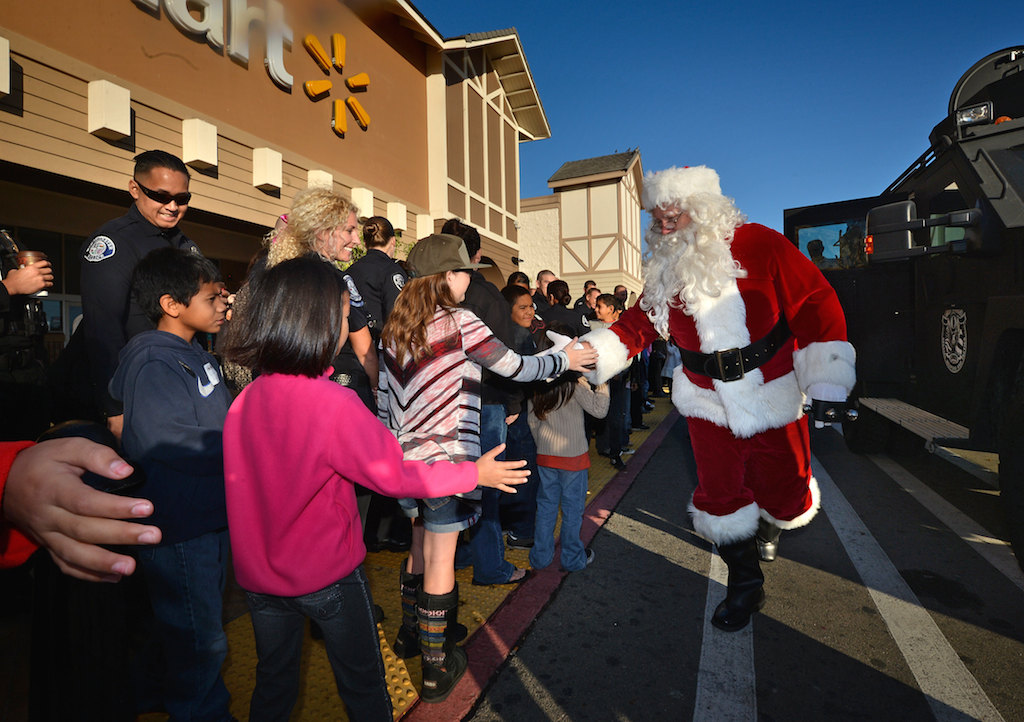 Santa arrives at the Walmart in Westminster at the start of the Shop with a Cop event. Photo by Steven Georges/Behind the Badge OC