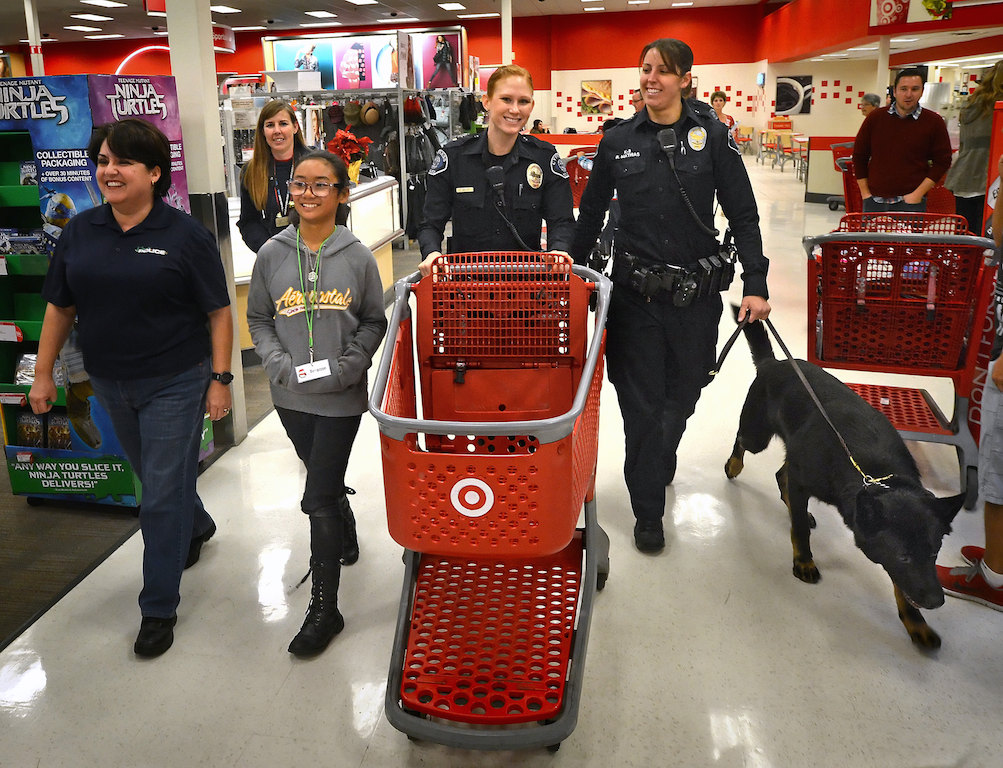 The Cypress Police Department treated four kids from the Boys & Girls Club of Cypress to a shopping trip as part of their Shop with a Cop holiday outreach. Photo by Steven Georges/Behind the Badge OC