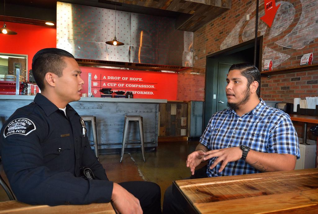 Bak and Perez catch up last week at the coffee shop in Corona where Perez works as a barista. Photo by Steven Georges/Behind the Badge OC