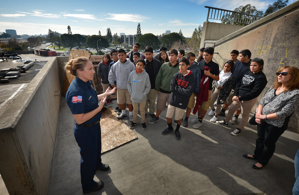 Anaheim Fire & Rescue Firefighter Lacee Valente takes the students to one of the top floors of the fire training tower at the North Net Training Center in Anaheim. Photo by Steven Georges/Behind the Badge OC