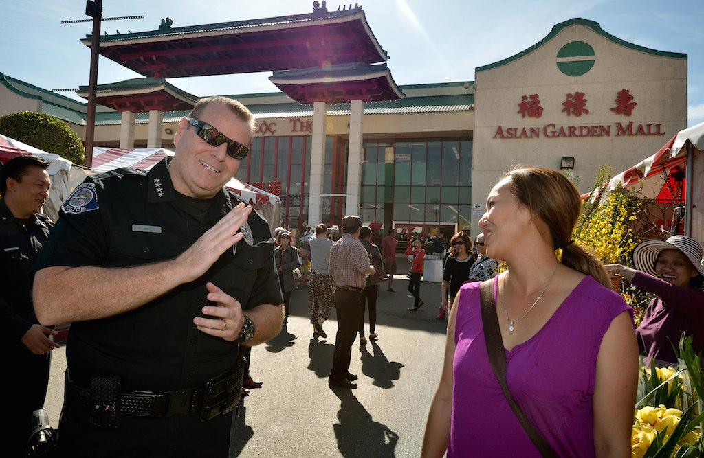 Westminster Police Chief Kevin Baker talks to Jacqueline Nguyen who has a fresh fruit shop in the Asian Garden Mall in Westminster’s Little Saigon called Trai-Cay Ngon. Photo by Steven Georges/Behind the Badge OC