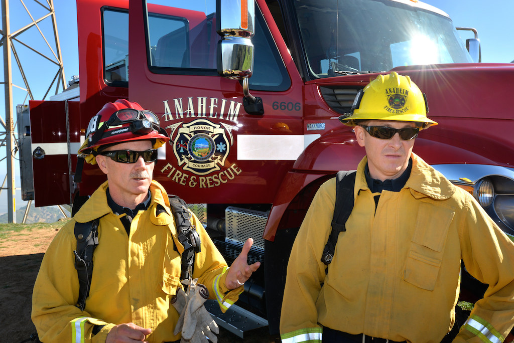 Capt. Jerry George, left, and Firefighter James Moreta in front of Engine 309, a Type 3 wildland fire engine, at Starr Ranch where the fire department often trains. Photo by Steven Georges/Behind the Badge OC