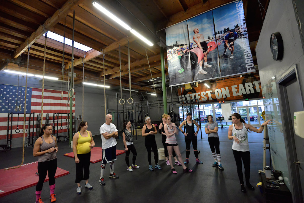 CrossFit trainer xxxx leads a recent workout at CrossFit Ethos in Laguna Hills. Photo by Steven Georges/Behind the Badge OC