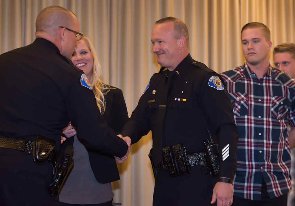 Lt. Thomas DaRe is presented with his new badge. Photo: Steven Georges