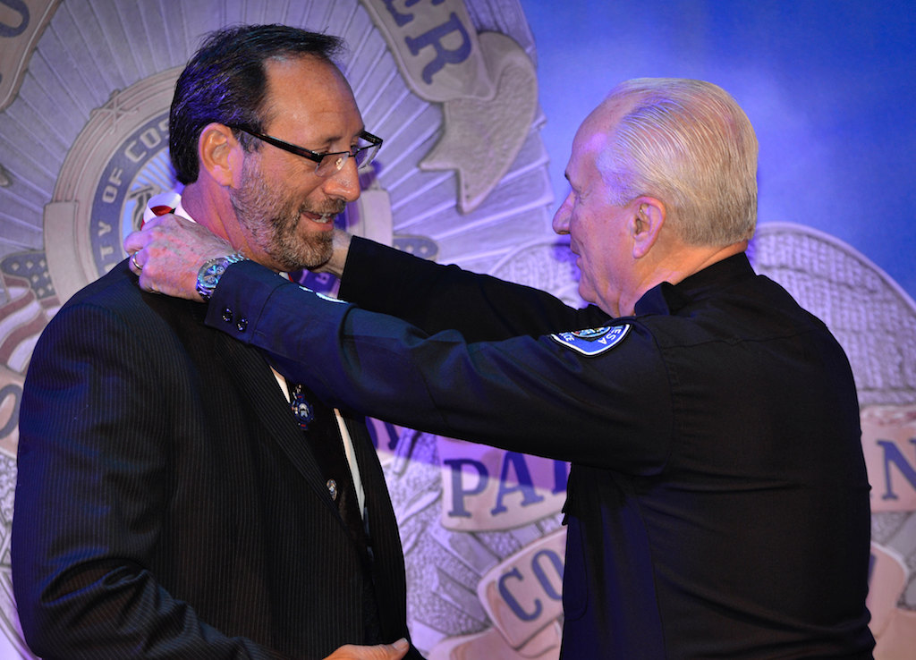 Retired Costa Mesa Police Officer Scott May receives the Life Saver medal from Interim Chief Ron Lowenberg. Photo by Steven Georges/Behind the Badge OC