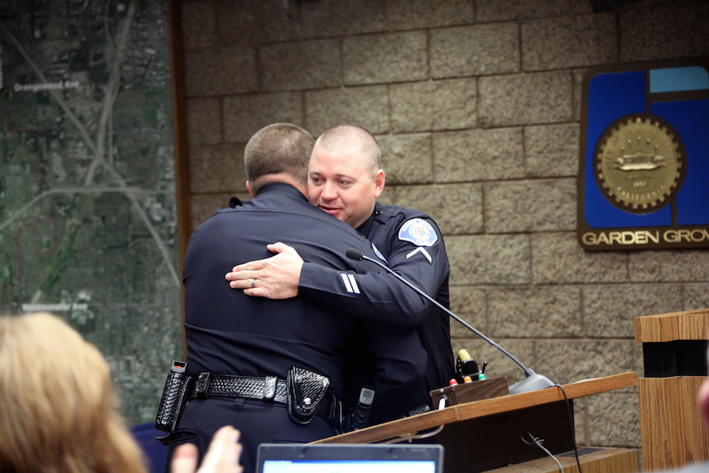 Chief Elgin and Master Officer Starnes embrace. Photo courtesy City of Garden Grove.