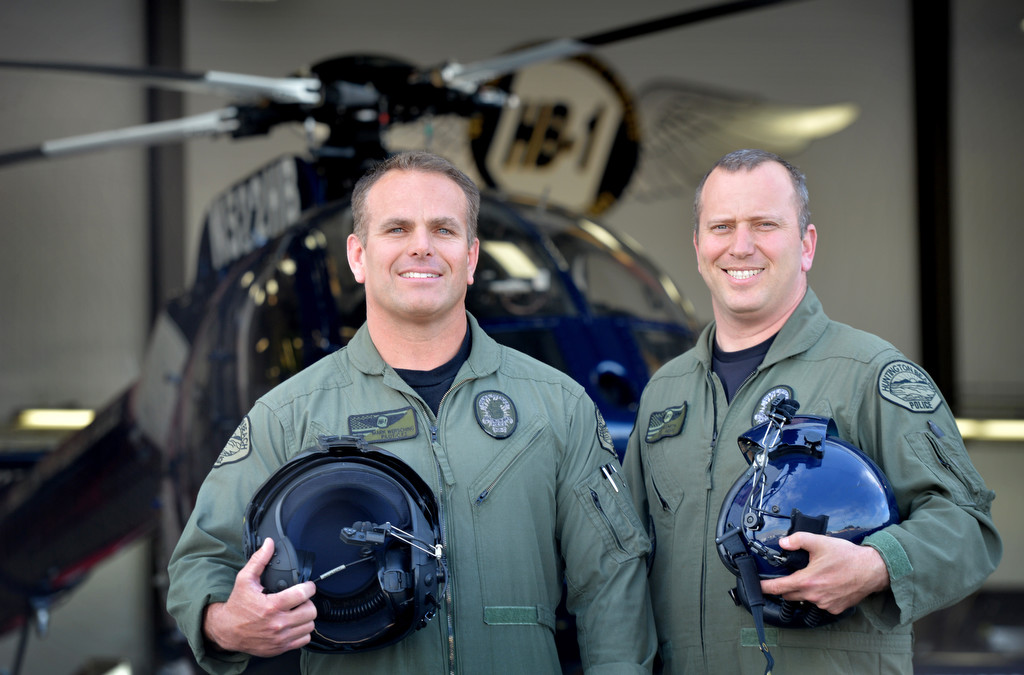 Huntington Beach Police Officer Mark Wersching, pilot Aero Unit, left, with Sgt. Chris Nesmith, Air Support Unit, in front of an MD 520N police helicopter at the Huntington Beach police heliport. Photo by Steven Georges/Behind the Badge OC