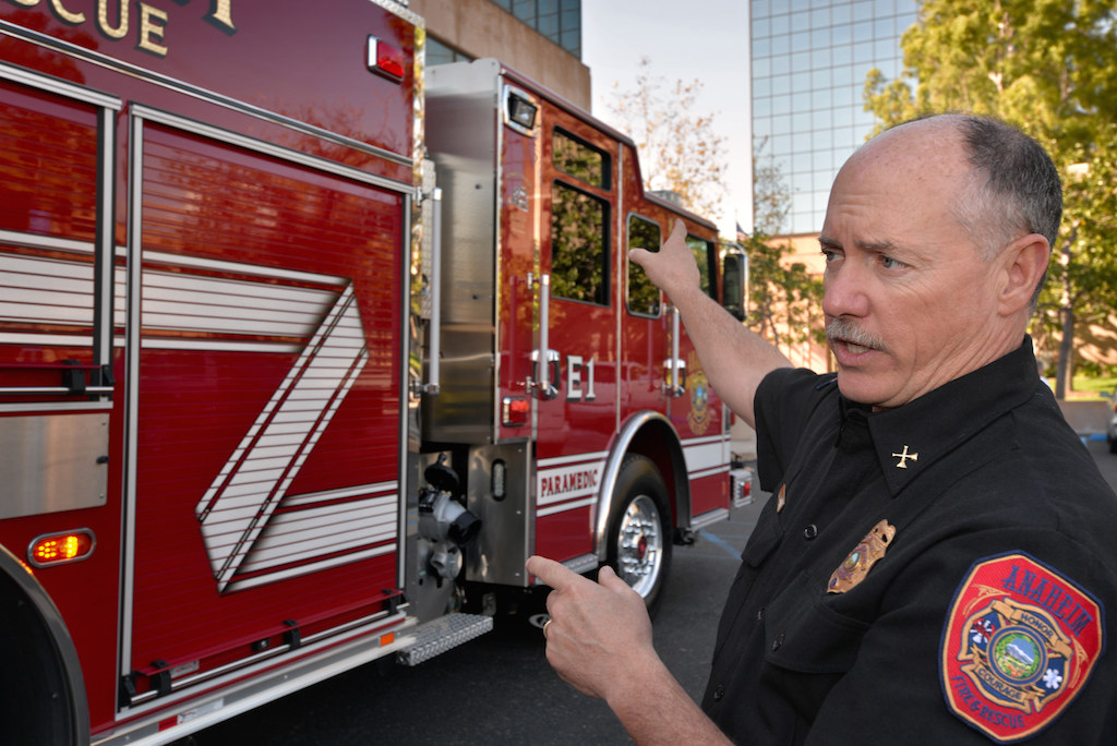 Battalion Chief Rusty Coffelt gives a tour of Anaheim Fire & Rescue’s Engine 1, Anaheim’s newest addition to the department. Photo by Steven Georges/Behind the Badge OC