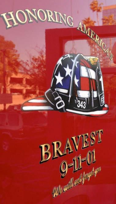 “Honoring America’s Bravest 9-11-01, We will never forget you.” reads the side of Anaheim Fire & Rescue’s newest, Engine 1, see here with Battalion Chief Coffelt stepping out. The plan is to eventually have the 9-11 display on all of the department’s trucks and engines. Photo by Steven Georges/Behind the Badge OC