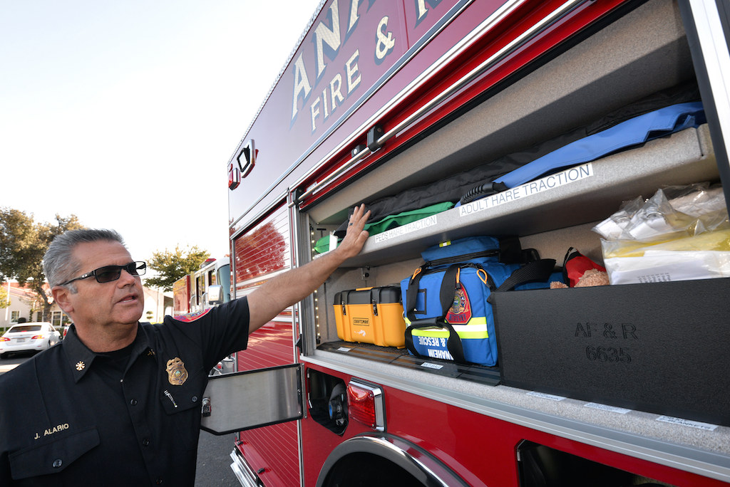 Jeff Alario, deputy chief of Support Services for Anaheim Fire & Rescue, shows off the new features of Engine 1. Photo by Steven Georges/Behind the Badge OC