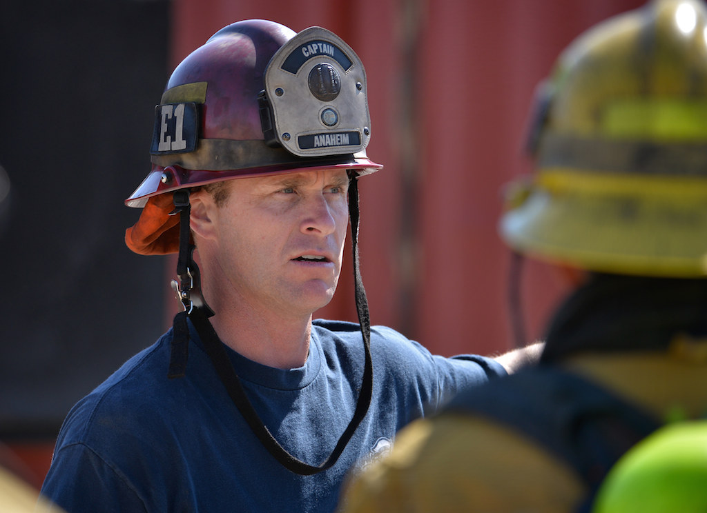 Captain Tim Sandifer of Anaheim Fire & Rescue lectures firefighters for a training exercise at the North Net Fire Training center in Anaheim. Photo by Steven Georges/Behind the Badge OC