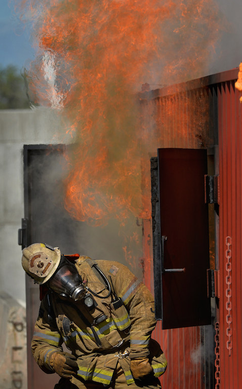Battalion Chief Tim Adams shows firefighters how quickly flames from a fire can erupt after that are given oxygen during recent training to observe xxxxx.  Photo by Steven Georges/Behind the Badge OC