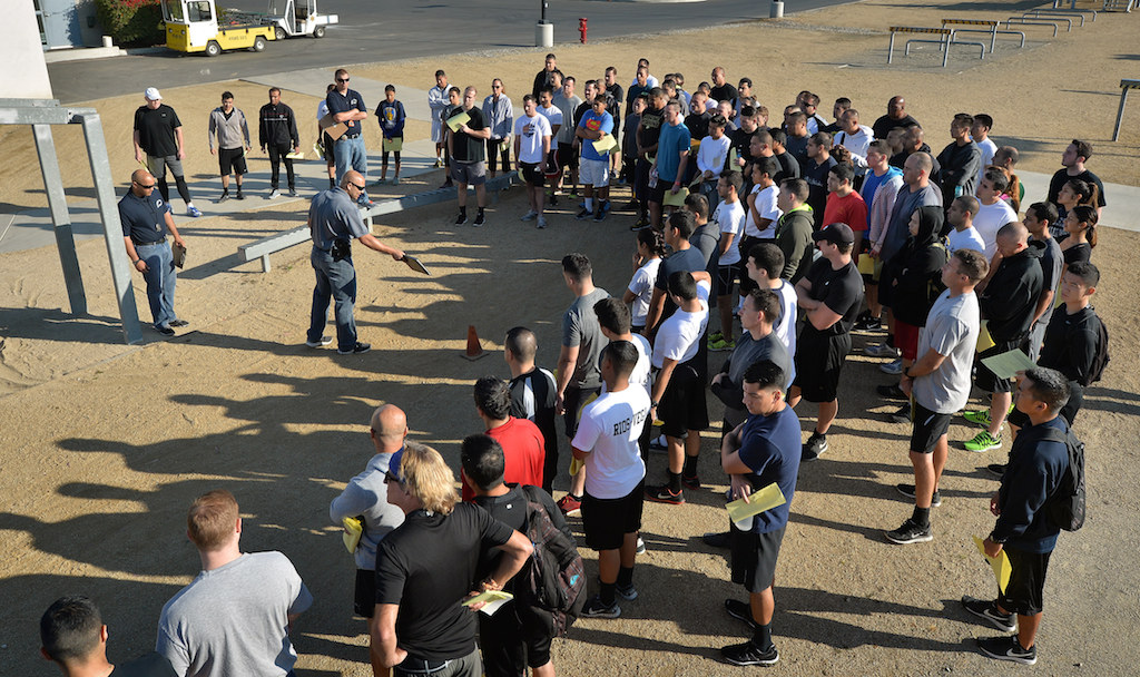 Applicants gather at the Orange County Sheriff's Regional Training Academy’s obstacle course for instructions at the start of Garden Grove PD’s physical agility test. Photo by Steven Georges/Behind the Badge OC