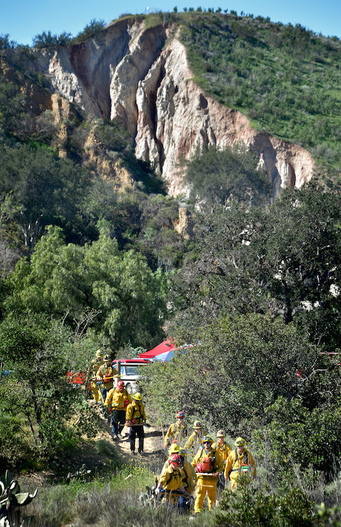 Firefighters from Anaheim, Garden Grove and Orange start their hike from base camp up a hill with full wildfire fighting gear during a wildfire training session at Santiago Oaks Regional Park. Photo by Steven Georges/Behind the Badge OC