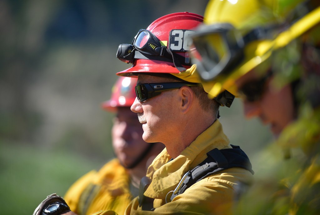 Captain Jerry George of Anaheim Fire & Rescue, leads a group of firefighters from Garden Grove, Orange and Anaheim in a wildfire training session at Santiago Oaks Regional Park. Photo by Steven Georges/Behind the Badge OC