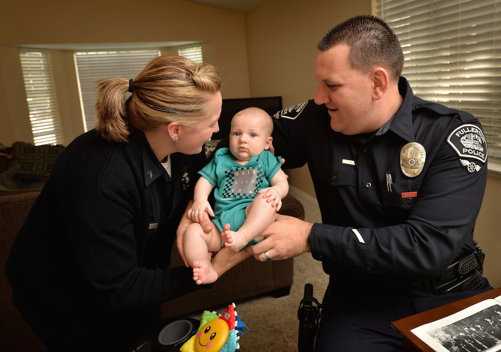 Fullerton PD Motor Officer Kyle Baas with his wife Jeannette Baas, records dispatch supervisor for the Covina Police Department, and their 3-month-old son John William Baas. Photo by Steven Georges/Behind the Badge OC