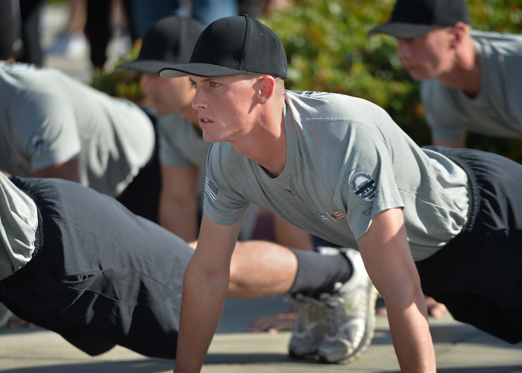 John Yergler does a few pushups with his class before a 3-mile run at the Orange County Sheriff's Regional Training Academy in Tustin. Yergler will be starting work at the Garden Grove Police Department. Photo by Steven Georges/Behind the Badge OC