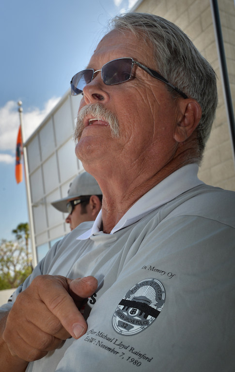 John Yergler, a retired officer with the Garden Grove PD, wears a shirt from a graduation class at the Orange County Sheriff's Regional Training Academy in Tustin that is being dedicated to his friend Michael Rainford, a Garden Grove Officer who was killed by a drunk driver in 1980. John’s son, a graduate from that class, will also be working at the Garden Grove PD. Photo by Steven Georges/Behind the Badge OC