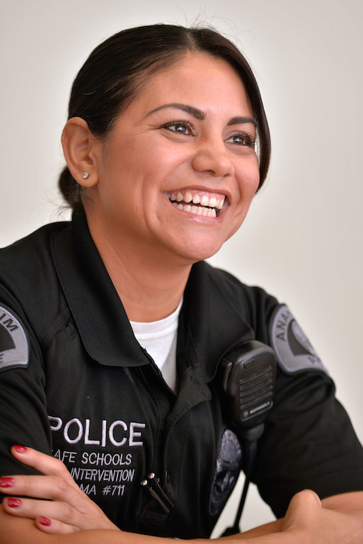 Palma gives a big smile as she talks about the kids she works with. Photo by Steven Georges/Behind the Badge OC