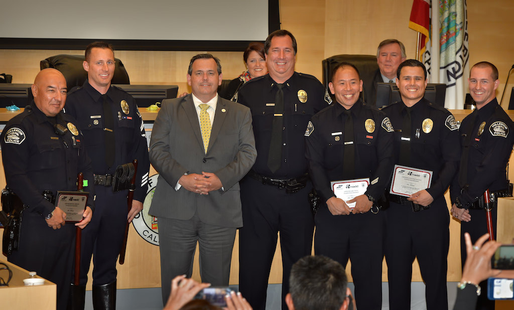 Fullerton Mayor Greg Sebourn, third from left, with Fullerton PD officers being honored for their contribution in getting drunk drivers off the road. FPD officers include Miguel Siliceo, left, Corporal Ryan Warner, Mayor Sebourn, Lt. Mike Chlebowski, Cary Tong, Jonathan Munoz and Timothy Gibert. Photo by Steven Georges/Behind the Badge OC