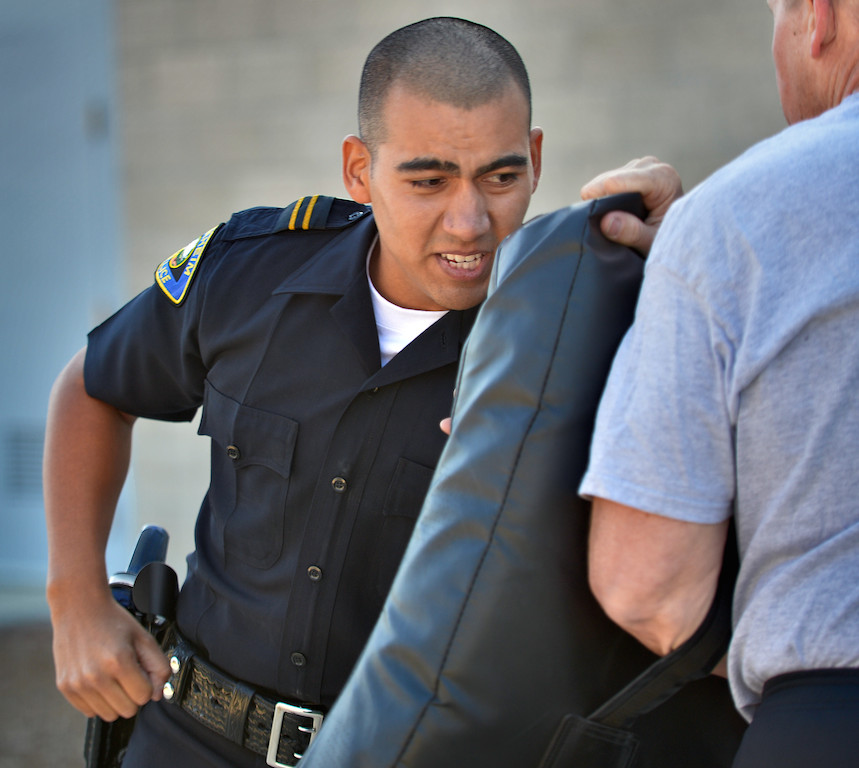 Anaheim PD Recruit Kevin Avila kids and punches a simulated suspect during an exhausting Will to Survive test at the OC Sheriff Training Academy in Tustin. Photo by Steven Georges/Behind the Badge OC