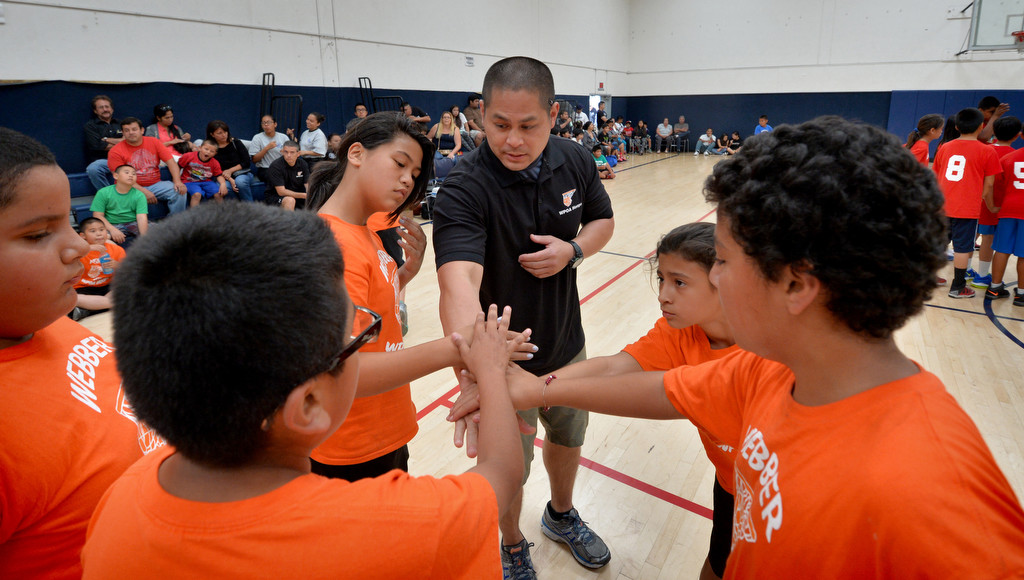 Team Webber huddles between quarters during the Hoops Basketball League championship game sponsored by the Westminster Police Officer's Association. Photo by Steven Georges/Behind the Badge OC