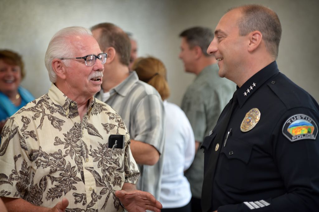 Tustin Police Chief Charles Celano, right, talks to retired Sgt. Bill Fisher  during the department’s retiree luncheon at the Tustin Ranch Golf Club. Photo by Steven Georges/Behind the Badge OC