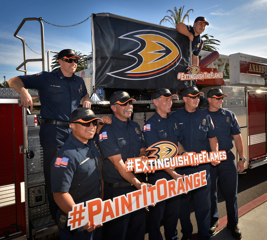 Anaheim Fire & Rescue personal stand in front of Truck 6 after arriving in front of the Honda Center ready to “Extinguish The Flames” before the start of Game 1 of the second-round NHL playoff series in Anaheim as the Anaheim Ducks host the Calgary Flames. Photo by Steven Georges/Behind the Badge OC