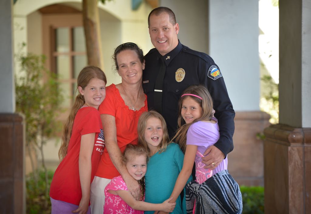 Tustin PD’s new Chaplain Jim Gwaltney with his wife Deb Gwaltney and kids Sierra, left, Addison, Evangeline and Katie. Photo by Steven Georges/Behind the Badge OC