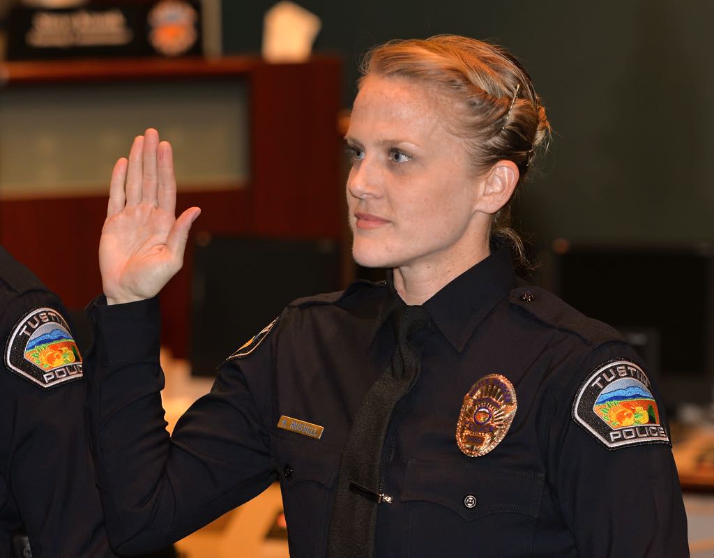 Kendal Russel, who has experience as a Santa Barbara police officer and a graduate of Cal State Long Beach, is sworn in as a new Tustin Police Officer. Photo by Steven Georges/Behind the Badge OC