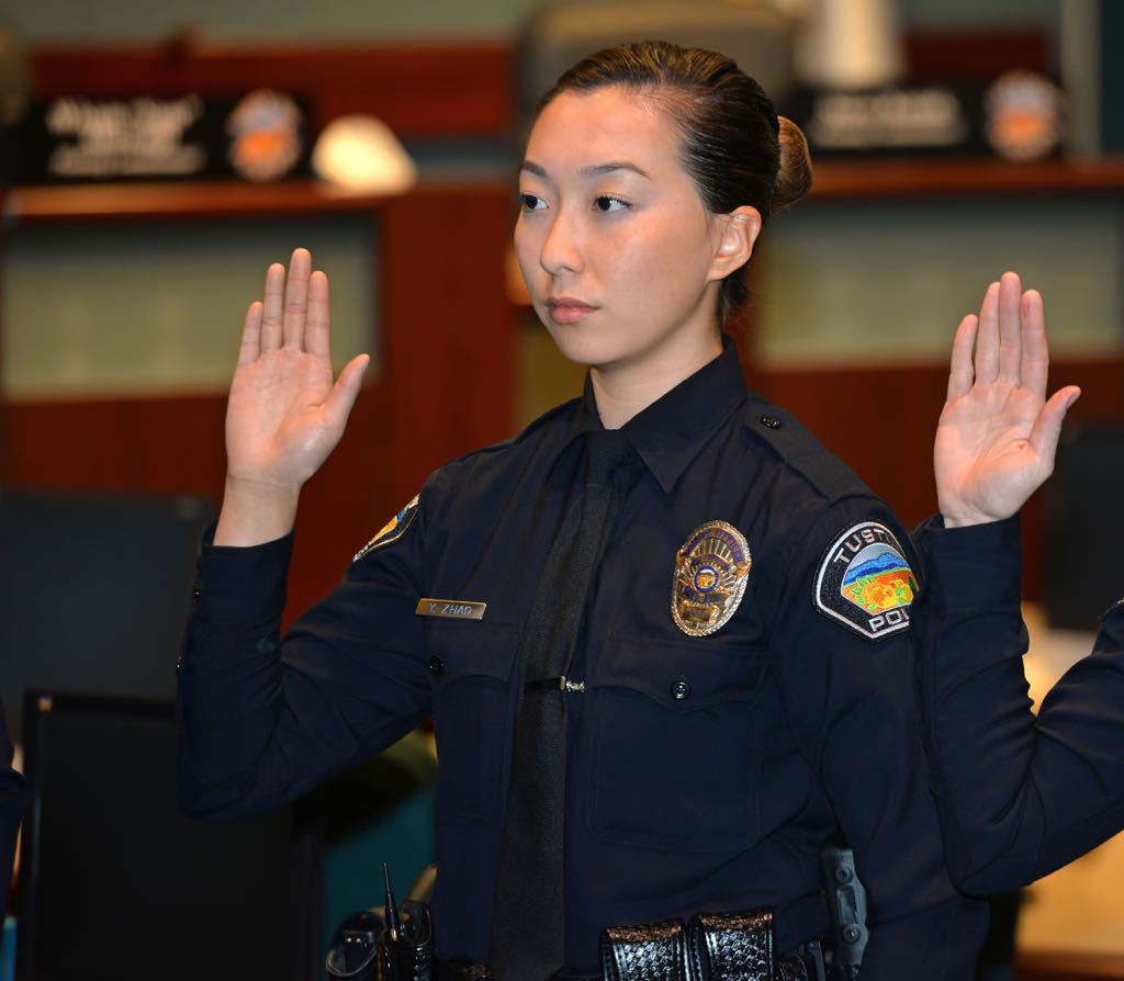Yun “Ivy” Zhao, a graduate of Golden West Police Academy, is sworn in as a new Tustin Police Officer. Photo by Steven Georges/Behind the Badge OC