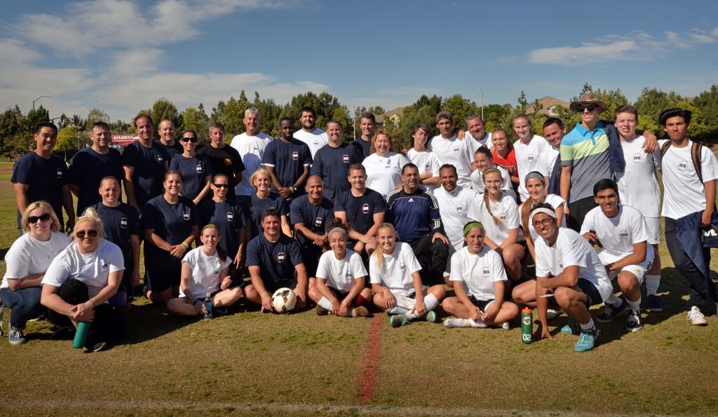 The Tustin and Irvine police soccer team gathers with the Beckman soccer team and the Harris family after playing a Kelsey Harris Memorial soccer game at Beckman High to raise money and awareness for Lafora research. Photo by Steven Georges/Behind the Badge OC