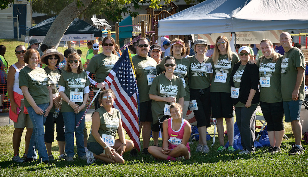 Members of Team Mac, friends and family of FPD Sgt. Mike MacDonald who passed away from melanoma cancer in 2009 and his wife Karen MacDonald, gather after completing the iCureMelanoma 5k that includes, Karen MacDonald, fifth from right, and Fullerton Police Chief Dan Hughes, right. Photo by Steven Georges/Behind the Badge OC