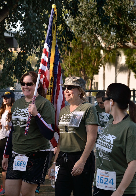 Sydney Salcido, left, walks with Karen MacDonald and Sgt. Katie Hamel, right, during the iCureMelanoma 5k at Laguna Rd. School Park in Fullerton to raise money funding research for a cure for Melanoma Cancer. Photo by Steven Georges/Behind the Badge OC