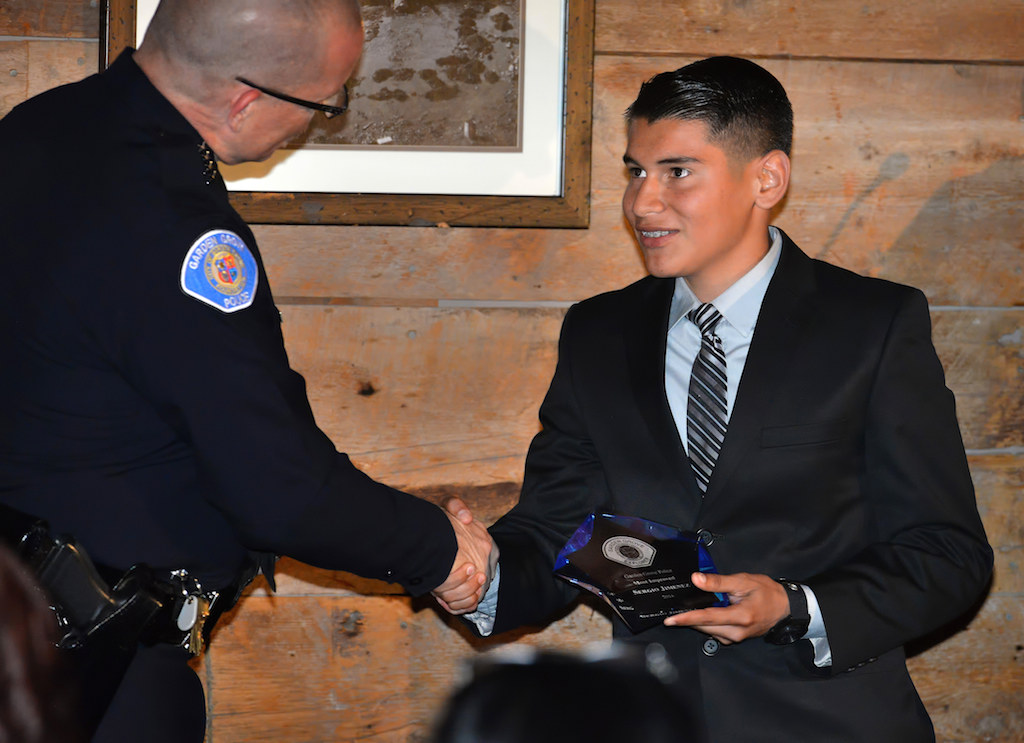 Explorer Sergio Jimenez receives the Most Improved Award from Police Chief Todd Elgin during the Garden Grove Police Explorer Post 1020 Awards Banquet. Photo by Steven Georges/Behind the Badge OC