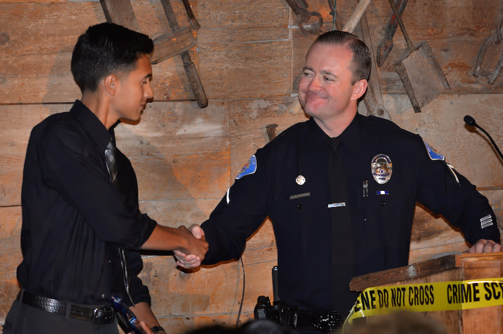 Explorer Cpl. Daniel Alvarez receives the Most Inspirational Award from Officer Jason Perkins during the Garden Grove Police Explorer Post 1020 Awards Banquet. Photo by Steven Georges/Behind the Badge OC