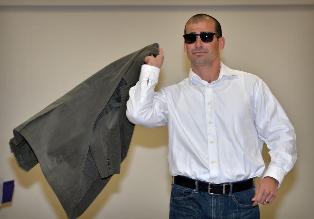 Det. Tommy Lomeli shows how to “Work Undercover” as he makes his way down the runway during the Mother’s Day Luncheon & Fashion Show at the Tustin Area Senior Center. Photo by Steven Georges/Behind the Badge OC