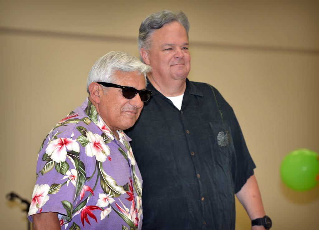 Volunteer Rich Ruedas and Investigator David Maher walk in style down the runway during the Mother’s Day Luncheon & Fashion Show at the Tustin Area Senior Center. Photo by Steven Georges/Behind the Badge OC