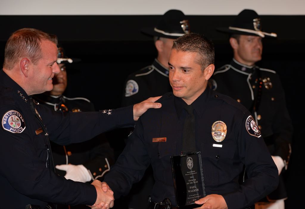Officer Paul Walker receives the Officer of the Year award from Chief Kevin Baker during the 2014 Westminster PD Awards Ceremony. Photo by Steven Georges/Behind the Badge OC