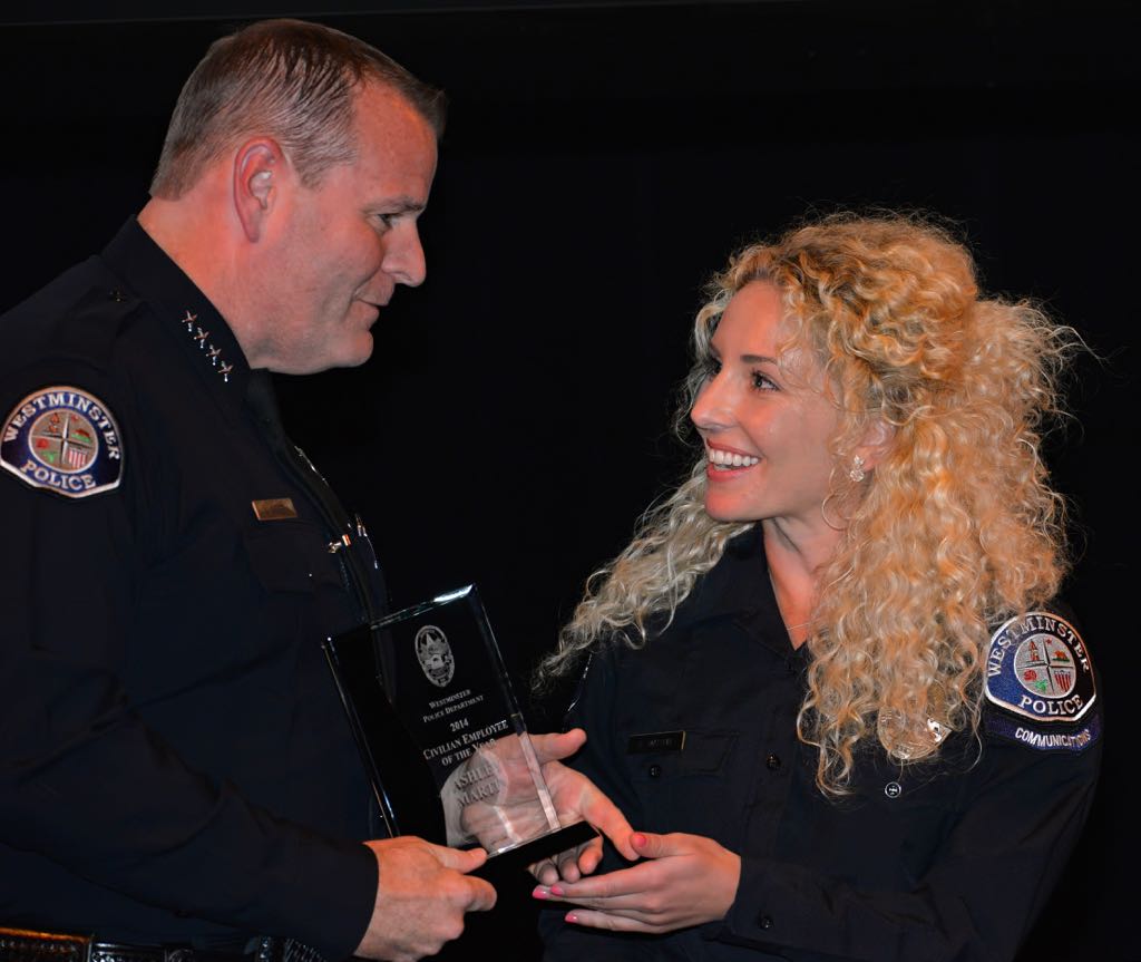 Police Dispatcher Ashley Martin is awarded Civilian Employee of the Year by Chief Kevin Baker during the 2014 Westminster PD Awards Ceremony. Photo by Steven Georges/Behind the Badge OC