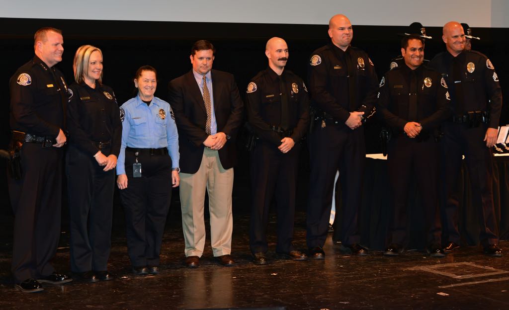 Receiving the awards of Excellence from Chief Kevin Baker, left, during the 2014 Westminster PD Awards Ceremony is from left, PSO Cynthia Moranville, Dispatcher Linette Giardina, Officer James Delk, Officer David Skube, Officer Dave Ferronato, Officer Derek Link, Sgt. Edward Esqueda and Sgt. Cord Vandergrift. Photo by Steven Georges/Behind the Badge OC
