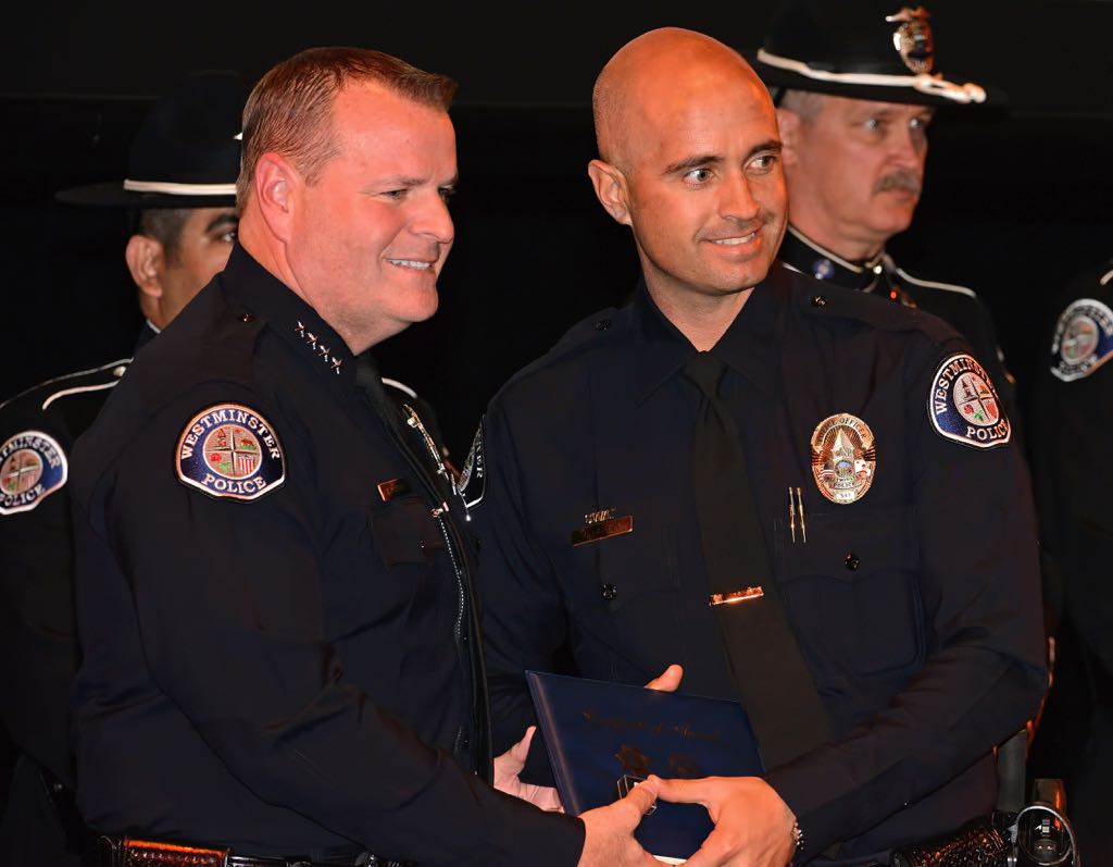 Det. Michael Harvey receives the ATAC Award from Chief Kevin Baker during the 2014 Westminster PD Awards Ceremony. Photo by Steven Georges/Behind the Badge OC