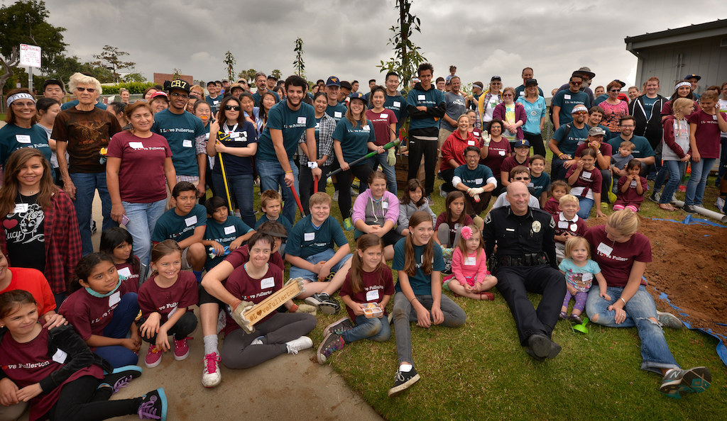 Volunteers at Golden Hill Elementary School in Fullerton gather for a group photo with Police Chief Dan Hughes as they help improve the school grounds during the second annual Love Fullerton community volunteer event. Photo by Steven Georges/Behind the Badge OC