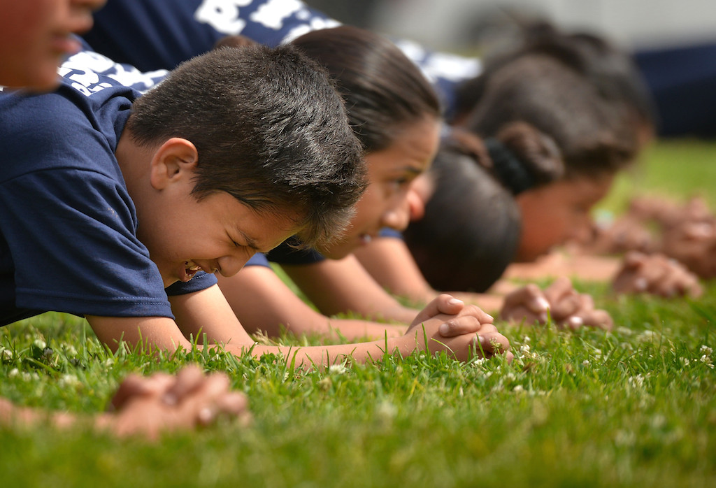 Jr. Cadets lineup for calisthenics during a Cops for Kids class at Paul Revere Elementary in Anaheim. Photo by Steven Georges/Behind the Badge OC