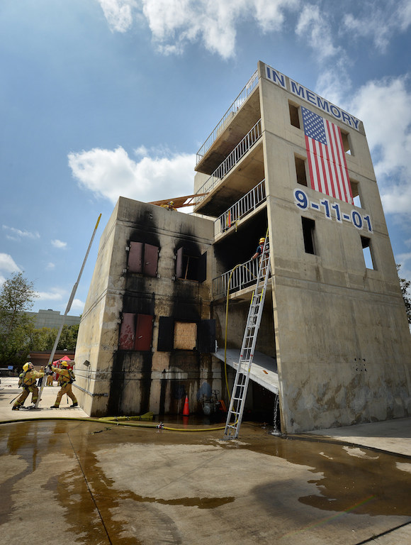 Recruits erect a ladder at the tower of the North Net Training Center in Anaheim. Photo by Steven Georges/Behind the Badge OC