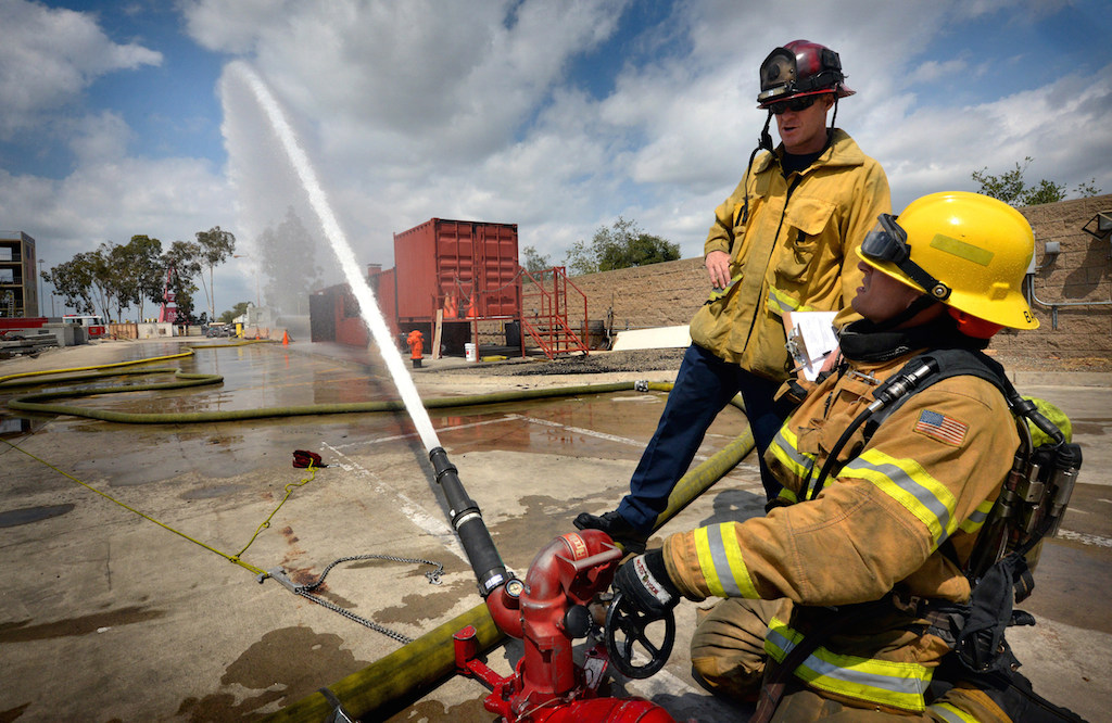 Anaheim Fire & Rescue Captain Morris watches over Recruit Tyler Bashaw during a training exercise at the North Net Training Center in Anaheim. Photo by Steven Georges/Behind the Badge OC